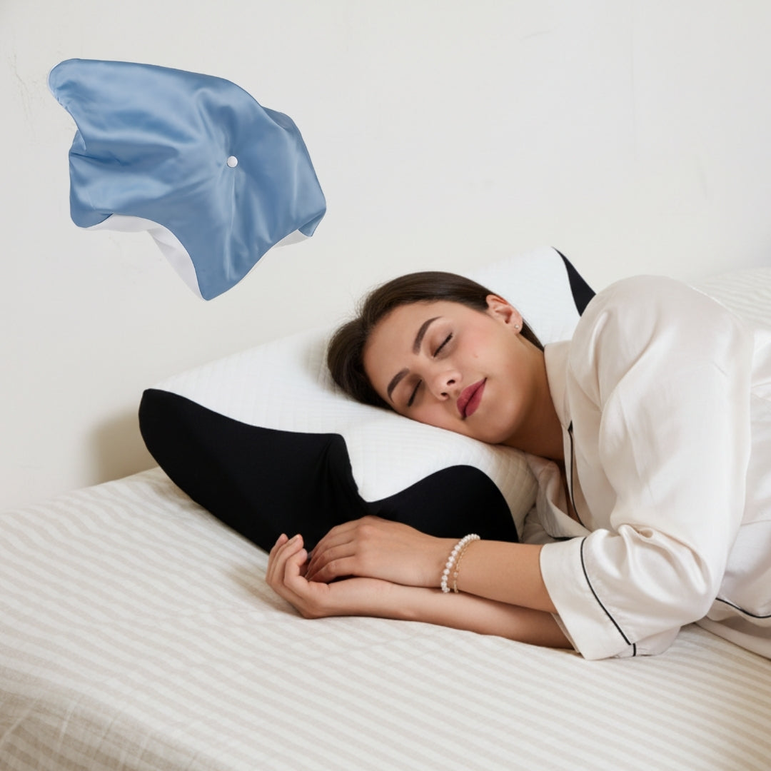 Woman lying on a bed with on an ergonomic cervical neck pillow from serene island